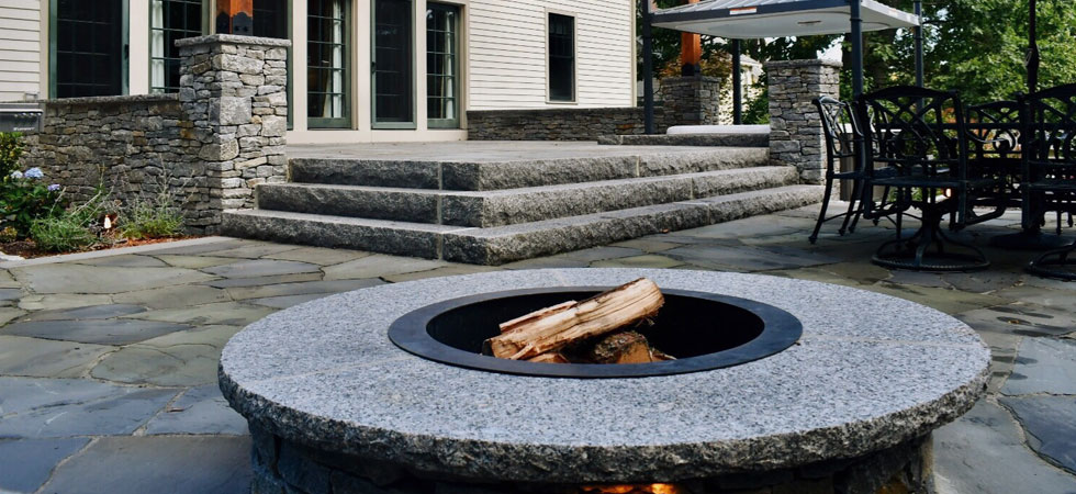 granite fileplace, stone steps, and outdoor patiol